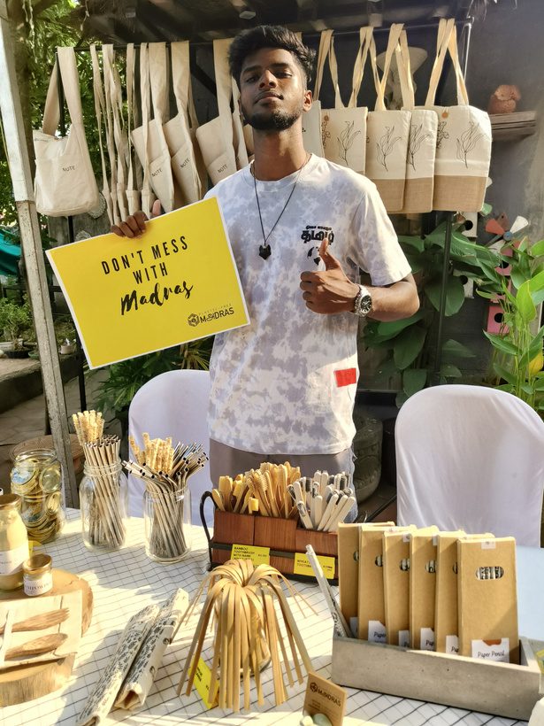 Printed cloth bags hung at a pop-up stall